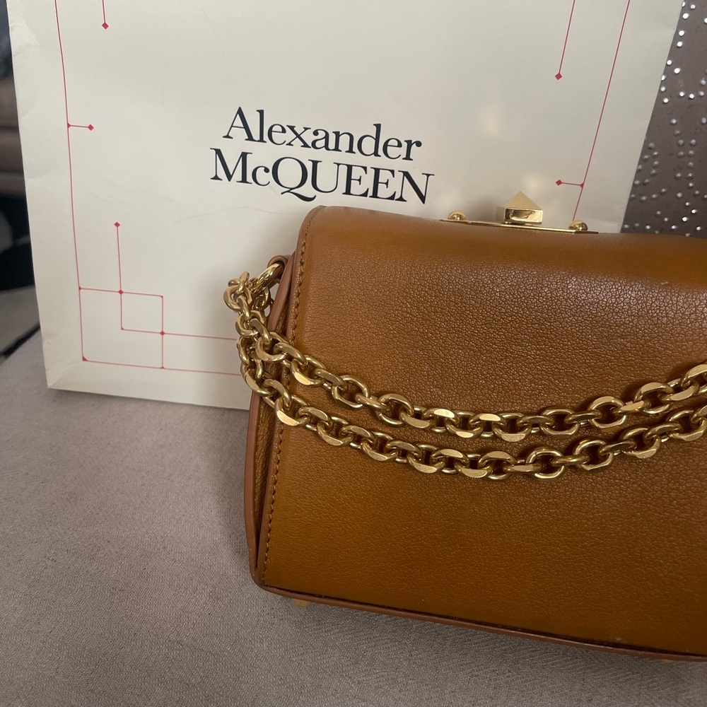 Alexander McQueen handbag show the bag or clutch 100% authentic